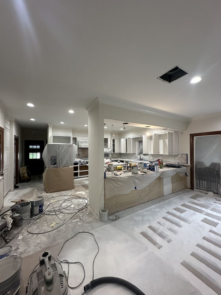 Open-concept kitchen remodel in progress by Grupo Constructor Medina
